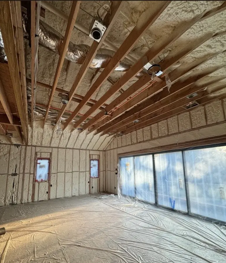 Interior walls and ceiling insulated with spray foam during new construction in Kearns